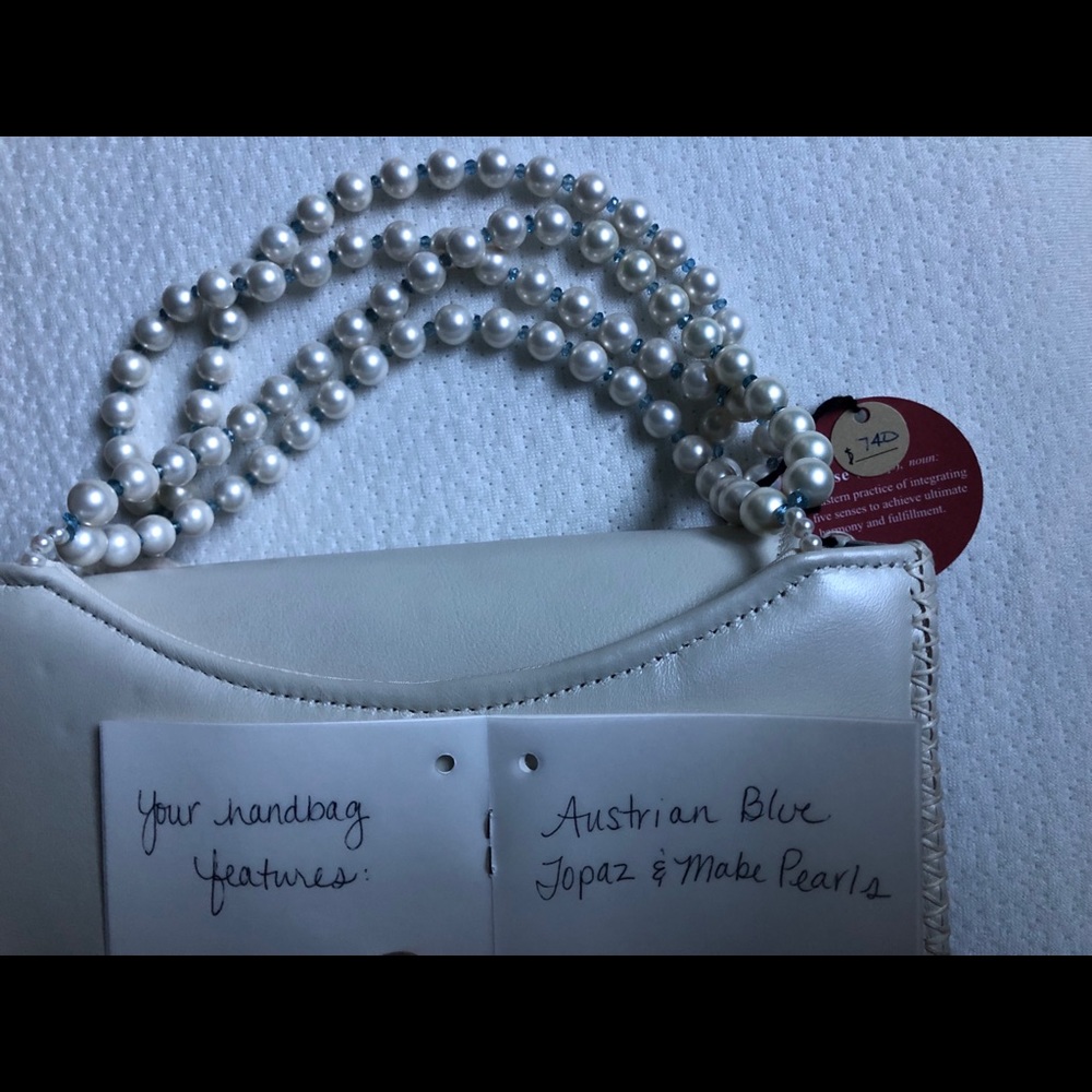 Very unique Zense,hand bag. Featuring blue topaz and Mabe Pearls from Africa